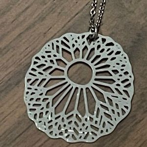 Stunning detailed anemone laser cut into thin stainless steel. On silver chain